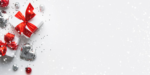 Christmas and New Year holiday background. Xmas greeting card. Christmas red ribbon gifts and...