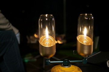 Light a gas lantern in the camp