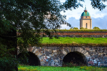 Helsinki. Finland. Suomenlinna Fortress. View of the fortress of Sveaborg through the branches of a...