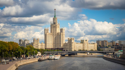 Moscow. Russia. High-rise building on Kotelnicheskaya embankment under gray clouds. Panorama of Moscow. Architecture of the capital of the Russian Federation. Gray water in the river Moscow.Boat trips