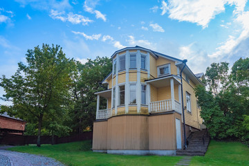 Helsinki. Finland. House with yellow walls. Cozy house among trees. View of Scandinavia in summer....
