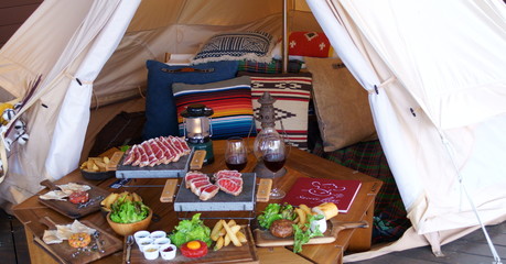 Meat dinner in outdoor tent