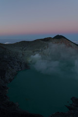 First light with fog. Sunrise on on the mountain  Ijen  Java ,Indonesia.