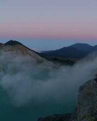 First light with fog. Sunrise on on the mountain  Ijen  Java ,Indonesia.