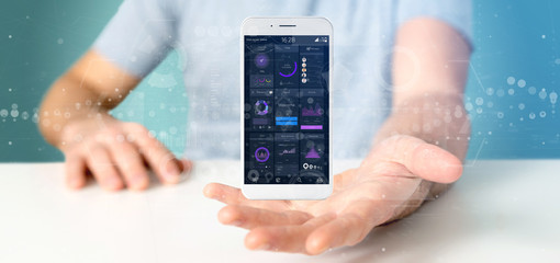 Businessman holding Smartphone with user interface data on the screen isolated on a background