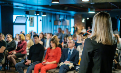 Female presenter speaks to audiences