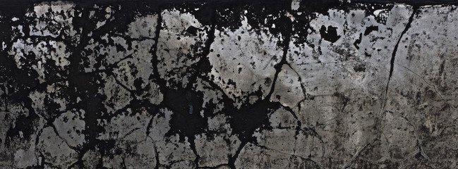 old black paint texture peeling off the concrete wall for dark theme banner background