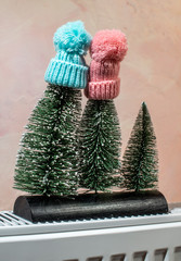 Pine trees with snow and winter hat.
