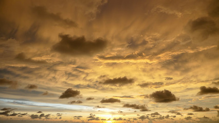 Beautiful sky with golden clouds in the west