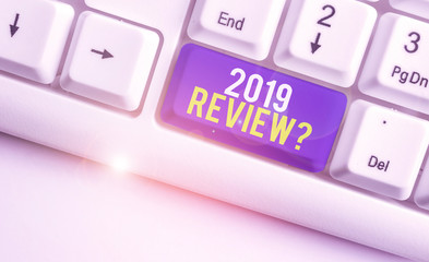 Word writing text 2019 Review Question. Business photo showcasing remembering past year events main actions or good shows White pc keyboard with empty note paper above white background key copy space