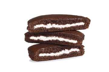 stack of chocolate cream cakes on white