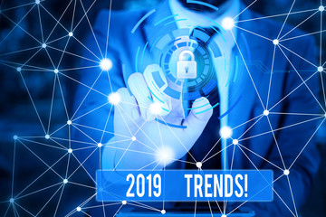 Obraz premium Writing note showing 2019 Trends. Business concept for general direction in which something is developing or changing Picture photo network scheme with modern smart device