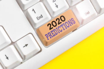 Text sign showing 2020 Predictions. Business photo text statement about what you think will happen in 2020 White pc keyboard with empty note paper above white background key copy space