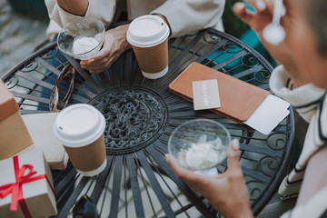 Friends eating dessert out of glass bowls