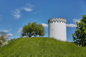 Old white water tower on rampart in city Fredericia, Denmark