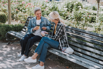 Two female friends sitting on the bench