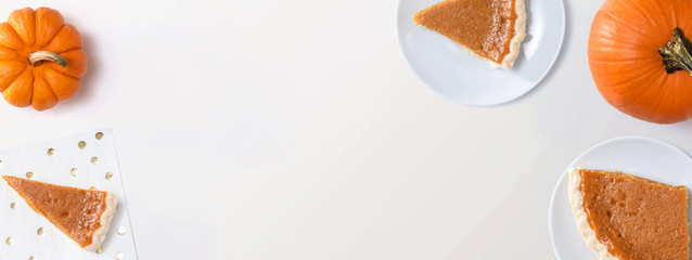 Pumpkin pie with autumn pumpkins - overhead view © Tierney