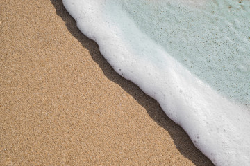 Soft wave on the sandy beach