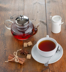 teapot and cup on a wooden tray. top view