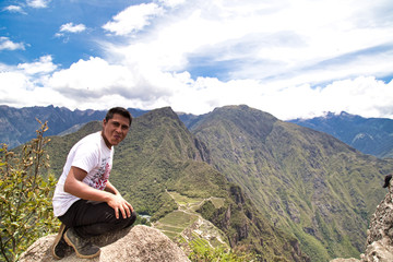 Naklejka premium Traveller at the Lost city of the Incas, Machu Picchu,Peru on top of the mountain, with the view panoramic
