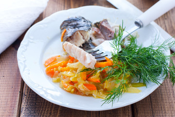 The flesh of baked white cupid on a white plate with waxes, selective focus