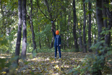 Fototapeta na wymiar masked girl halloween pumpkin in the forest