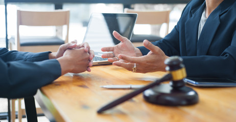 Concept of legal counseling. The lawyer or legal counsel is listening and providing advice to...