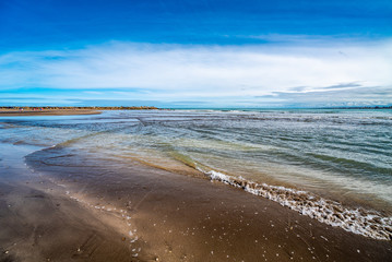 waves of the Atlantic Ocean rolling on the sand