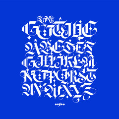 Gothic, English alphabet written in chalk. Font for tattoo and commercial purposes. Elements isolated on a blue background. Medieval latin letters are kept separately.