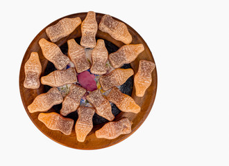 A dish full of bottle-shaped jelly sweets