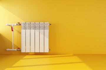 radiator heating on yellow wall