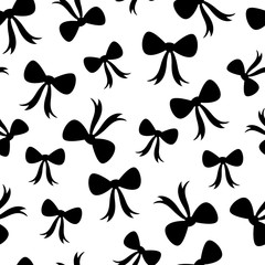 Vector seamless pattern of black bows scattered on a white background. Great for wrapping paper, baby showers and bedroom decor.
