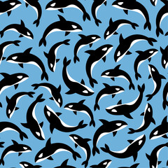 Vector seamless pattern of killer whales orca on a bright blue background. Great for sea and nautical themed decorations, textiles and stationery.
