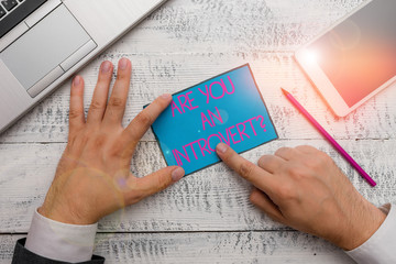 Text sign showing Are You An Introvertquestion. Business photo text demonstrating who tends to turn...