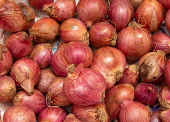 Close view of onions (shallots) in a basket