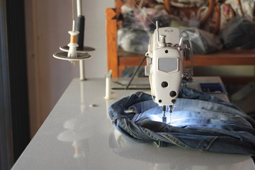 background, blue, closeup, cloth, clothes, clothing, component, cotton, craft, denim, detail, equipment, fabric, factory, fashion, hand, identity, industrial, industry, jeans, lag, light, machine, man