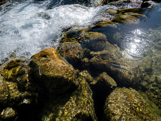 waterfall and stele with submerged stones