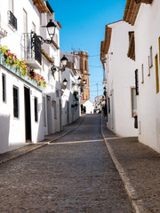 narrow white street of a coastal town