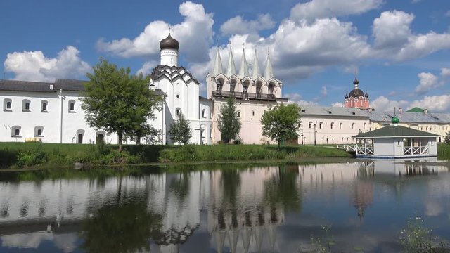 View of the bell tower of the Tikhvin assumption monastery on a Sunny July day. Tikhvin, Russia