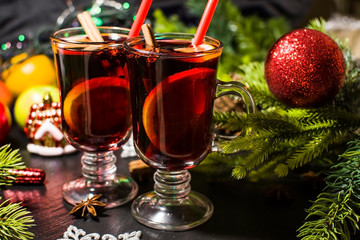 Christmas hot drink mulled wine with orange and cinnamon. Holiday decor. Selective focus.