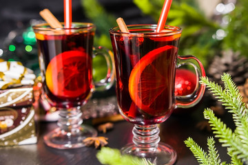 Christmas hot drink mulled wine with orange and cinnamon. Holiday decor. Selective focus.
