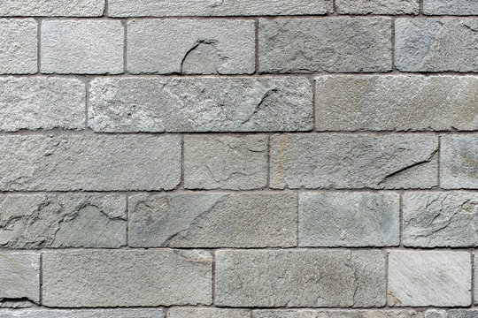 Fototapeta Closed up grey brick wall texture. Architectural material construction.