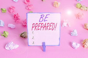 Handwriting text Be Prepared. Conceptual photo try be always ready to do or deal with something Colored crumpled papers empty reminder pink floor background clothespin