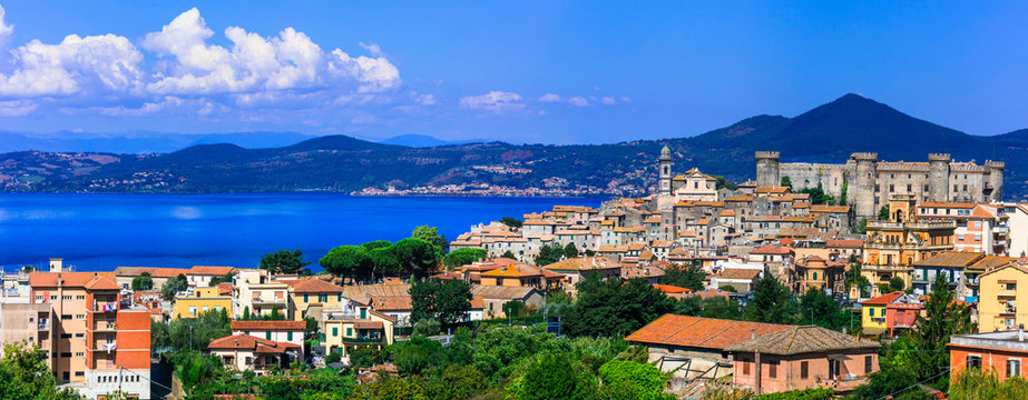 Bracciano medieval castle and historic village panoramic view over lake Italy. Scenic landscape of Odescalchi fortress, old town stone buildings in Lazio . World Print