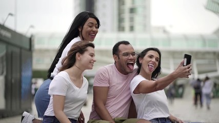 Joyful young people posing for self portrait. Smiling young people making various facial expressions for selfie. Concept of self portrait - Powered by Adobe