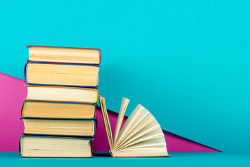 Open book, hardback books on wooden table. Back to school. Copy space