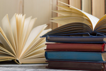 Open book, hardback books on wooden table. Back to school. Copy space