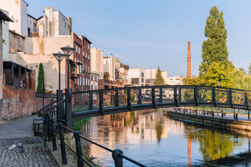 Bydgoszcz. View of the architecture and small bridge on the Brda river - obrazy, fototapety, plakaty