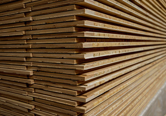 Stack of natural rough wooden boards. Wooden boards, lumber, industrial wood.
