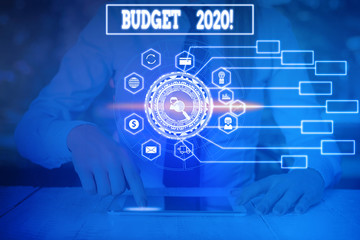 Writing note showing Budget 2020. Business concept for estimate of income and expenditure for next or current year Woman wear formal work suit present using smart latest device